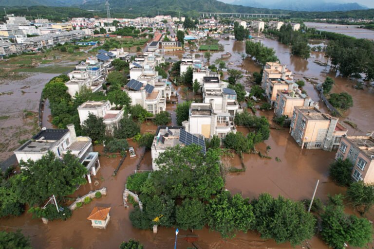 Shanghai Faces Deluge After Floods Kill at Least 30 in Beijing